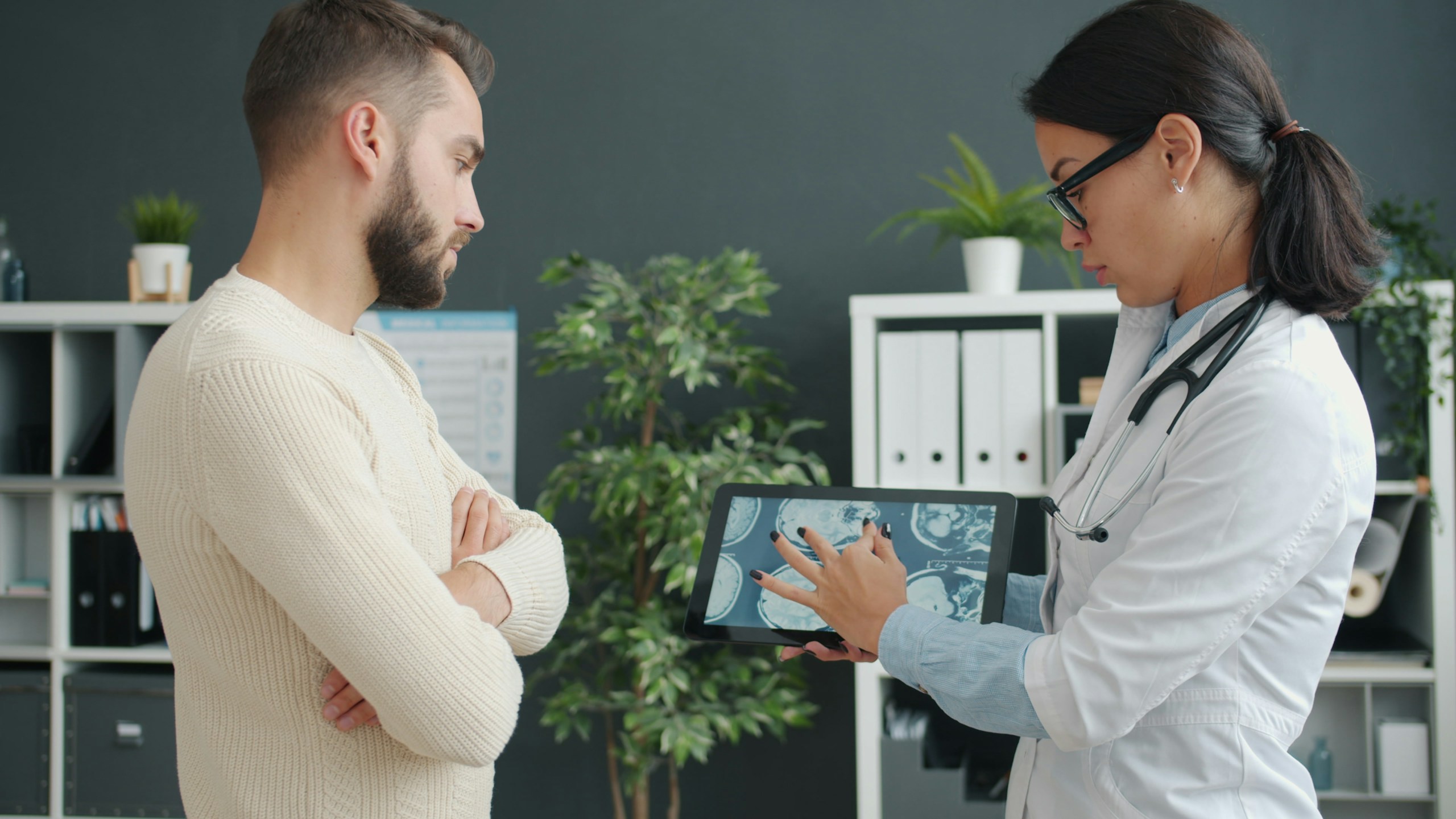 Illustrative doctor discussing medical information with an adult